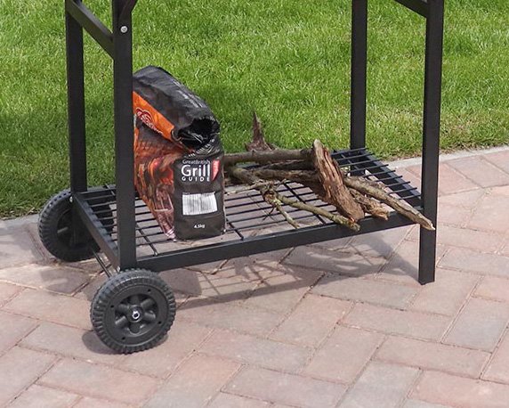 Mesh bottom shelf of charcoal grill