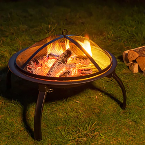 Fire pit in a garden with spare logs