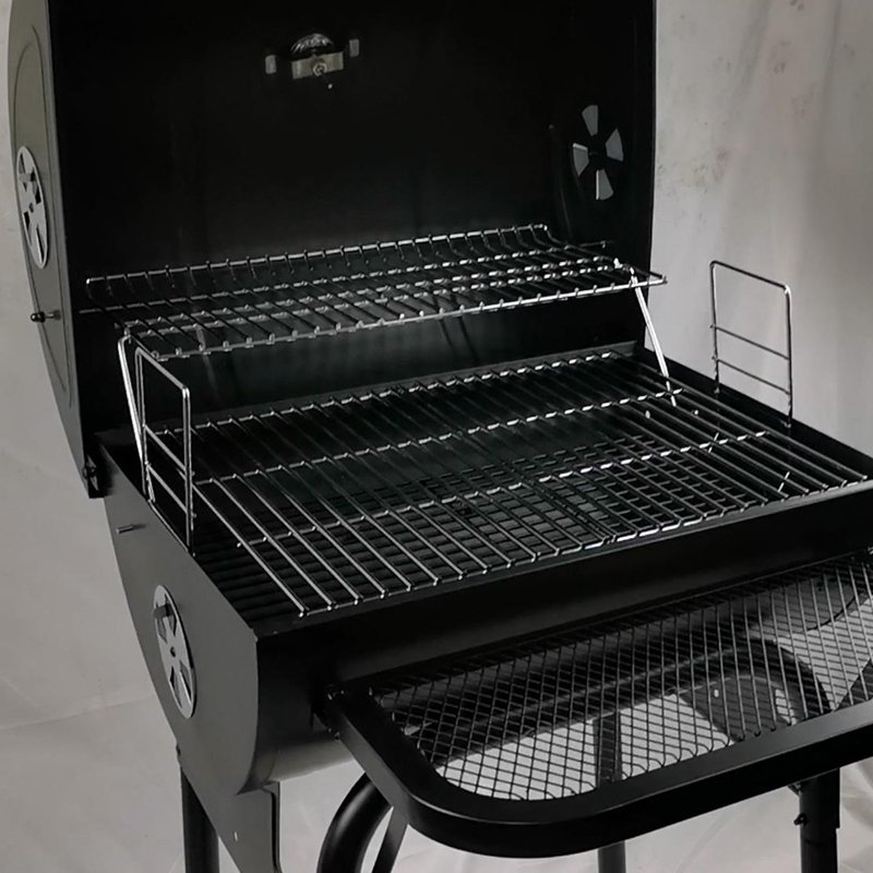 Barrel style charcoal grill with Warming grid